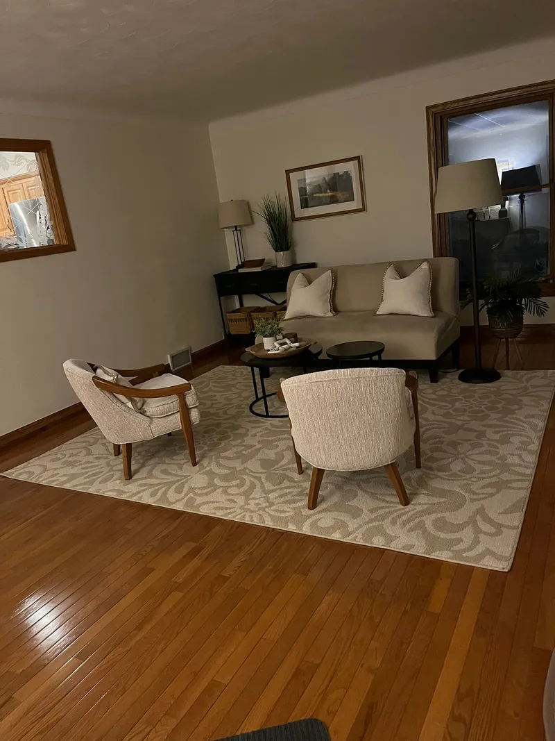 Freshly painted living room with clean walls and staged furniture in Fort Collins